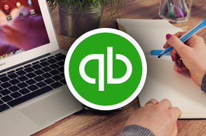 Working with QuickBooks on laptop